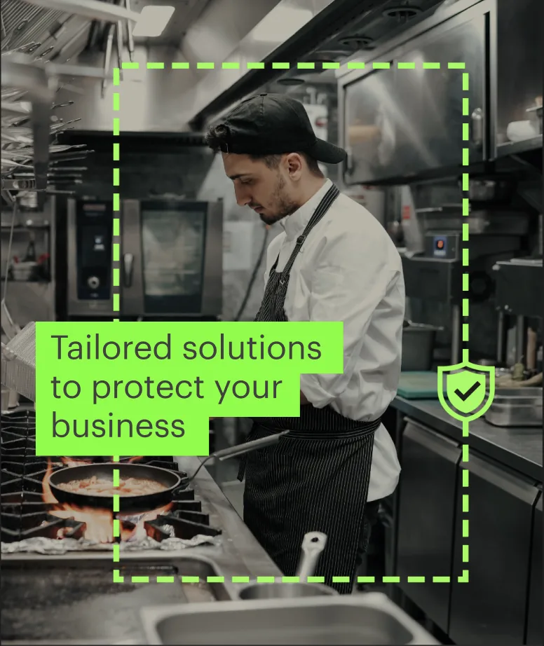 Model photo: a chef in a commercial kitchen, with the words Tailored solutions to protect your business